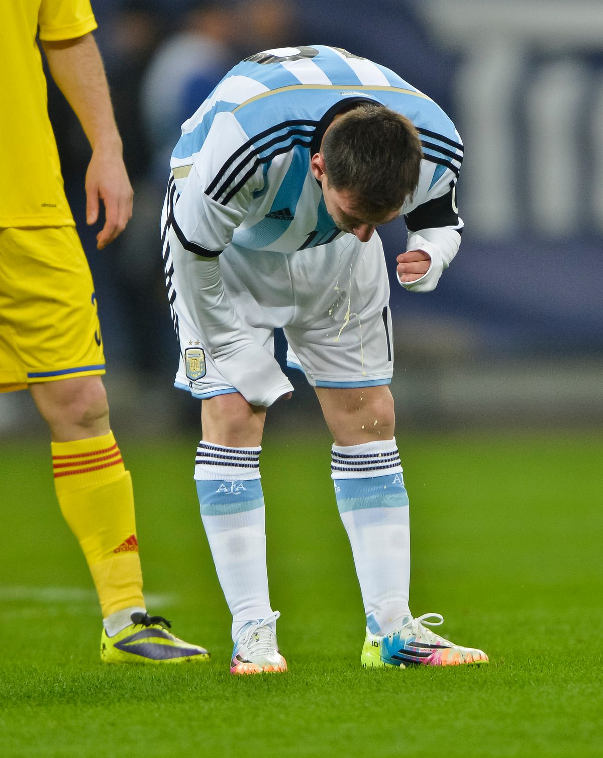 FILE - In this March 5, 2014 file photo, Argentina's Lionel Messi appears to vomit during an international friendly soccer game against Romania on the National Arena stadium in Bucharest, Romania. Messi has vomited at least a half-dozen times with Argentina and club team Barcelona, mystifying doctors and fans alike. (AP Photo, File) ROMANIA OUT (AP)