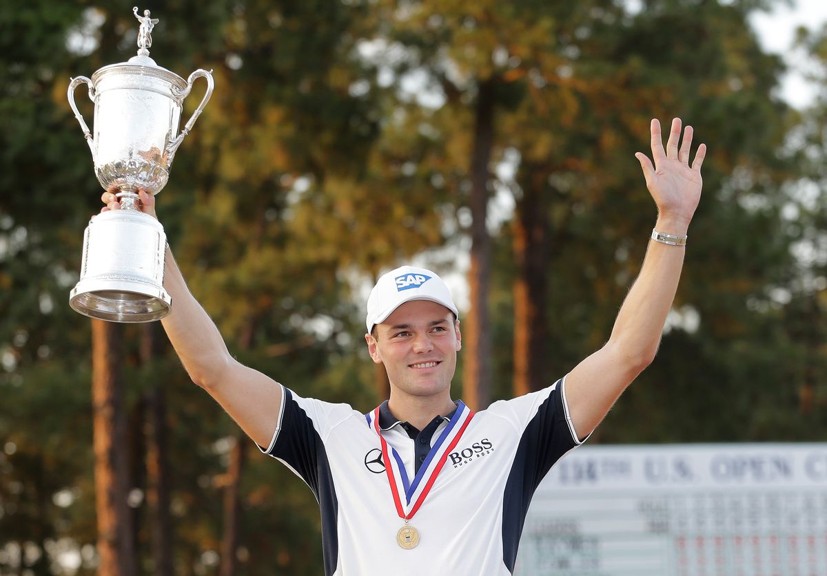 Martin Kaymer, of Germany, holds up the trophy after wining the U.S. Open golf tournament in Pinehurst, N.C., Sunday, June 15, 2014.  (AP Photo/Eric Gay) (Eric Gay)
