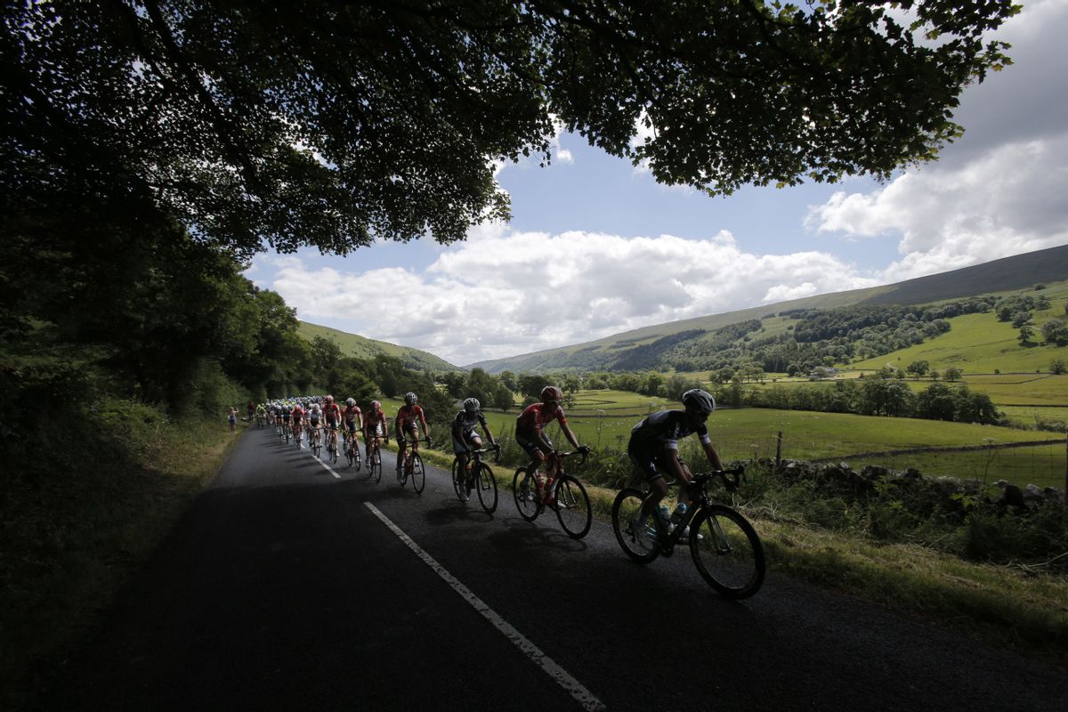 10ThingstoSeeSports - The pack rides through the rolling hills of Yorkshire during the first stage of the Tour de France cycling race over 190.5 kilometers (118.4 miles) with start in Leeds and finish in Harrogate, England, Saturday, July 5, 2014. (AP Photo/Christophe Ena, File) (AP)