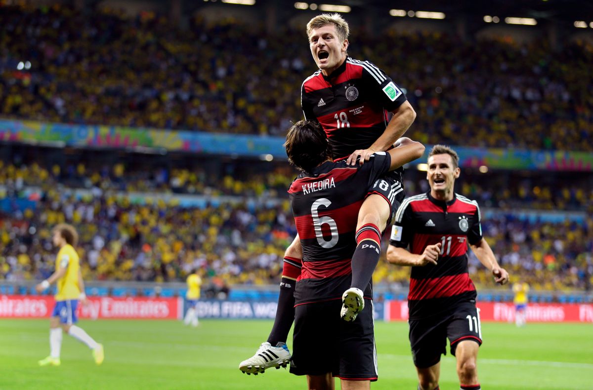 Germany's Toni Kroos celebrates with Sami Khedira (6) and Miroslav Klose (11) after scoring his side's fourth goal during the World Cup semifinal soccer match between Brazil and Germany at the Mineirao Stadium in Belo Horizonte, Brazil, Tuesday, July 8, 2014. (AP Photo/Natacha Pisarenko) (Natacha Pisarenko)