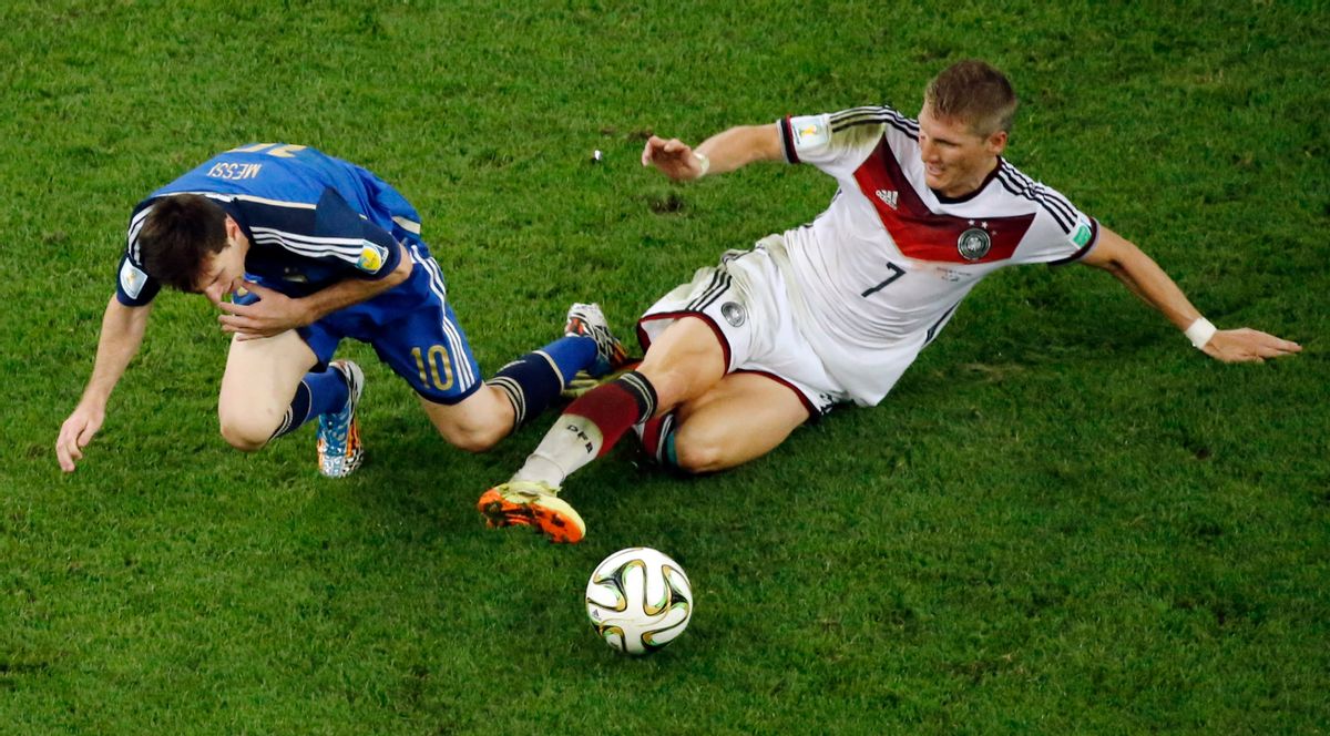 Germany's Bastian Schweinsteiger, right, tackles Argentina's Lionel Messi during the World Cup final soccer match between Germany and Argentina at the Maracana Stadium in Rio de Janeiro, Brazil, Sunday, July 13, 2014. ((AP Photo/Fabrizio Bensch, Pool))