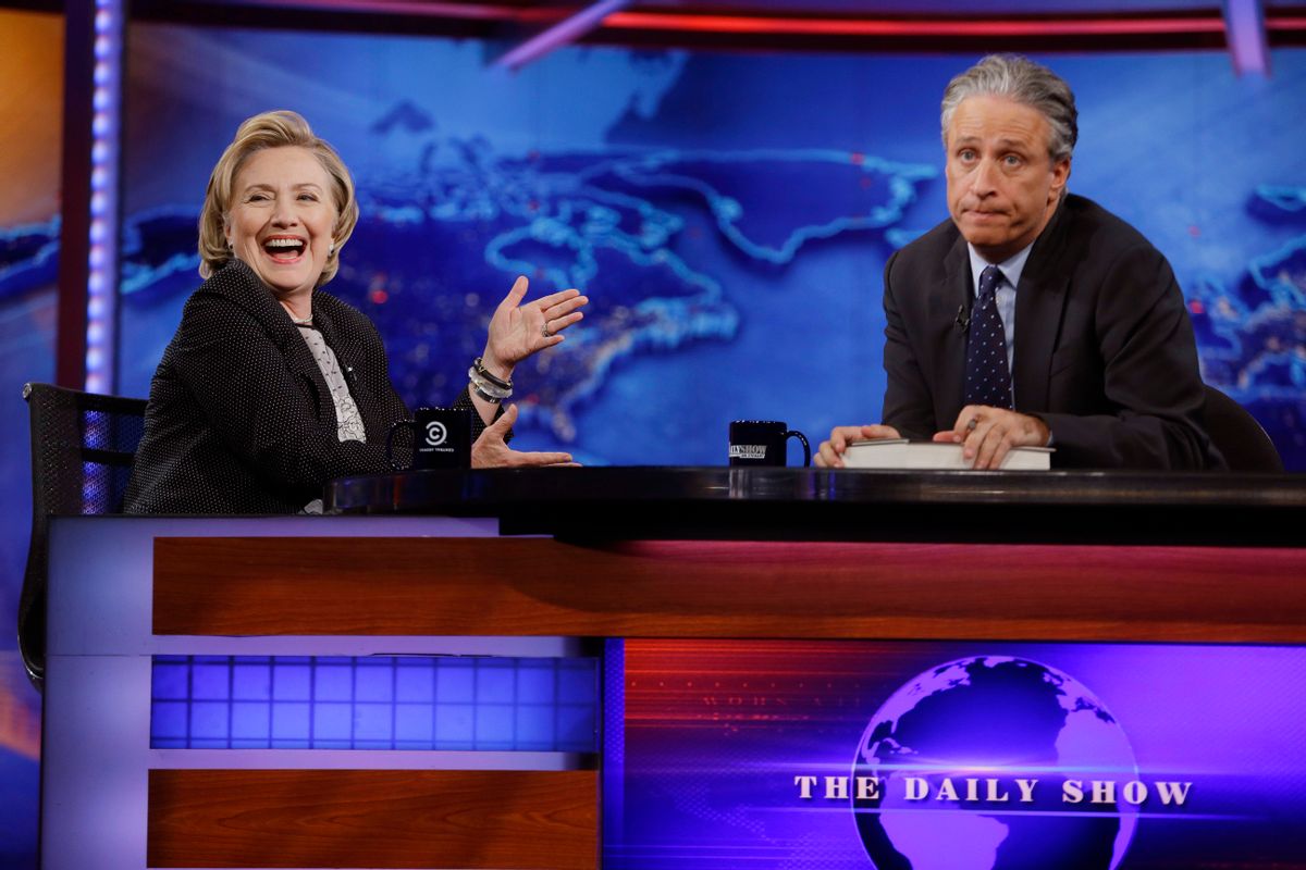 Former U.S. Secretary of State Hillary Rodham Clinton reacts to host Jon Stewart during a taping of "The Daily Show with Jon Stewart," Tuesday, July 15, 2014, in New York.  (AP Photo/Frank Franklin II) (AP)
