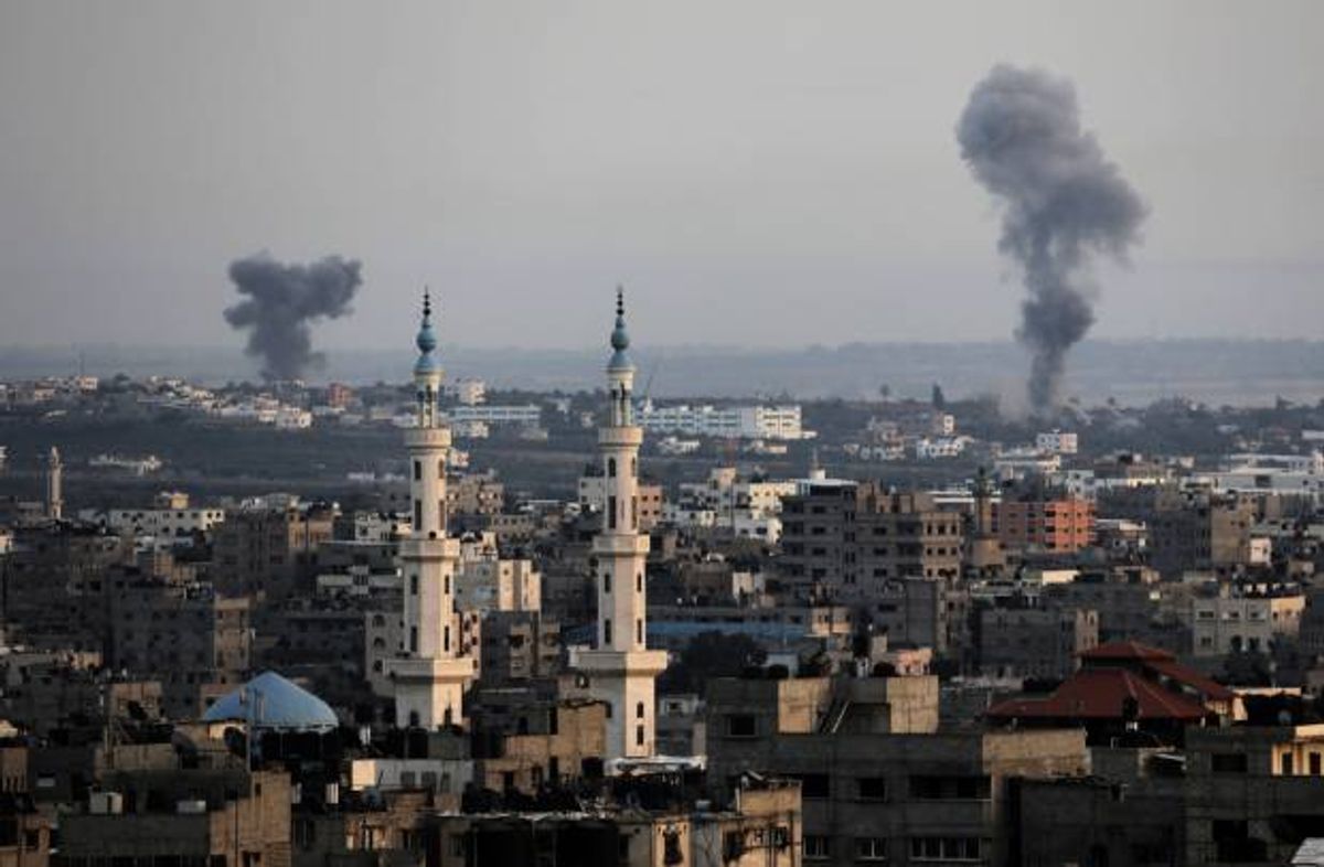 Columns of smoke rise following Israeli strikes on Gaza Strip, Saturday, July 12, 2014. Israeli airstrikes on Gaza hit a mosque and a center for the disabled where a few women were killed Saturday, raising the Palestinian death toll from the offensive to more than 130, Palestinian officials said, in an offensive that showed no signs of slowing down  (AP Photo/Adel Hana)