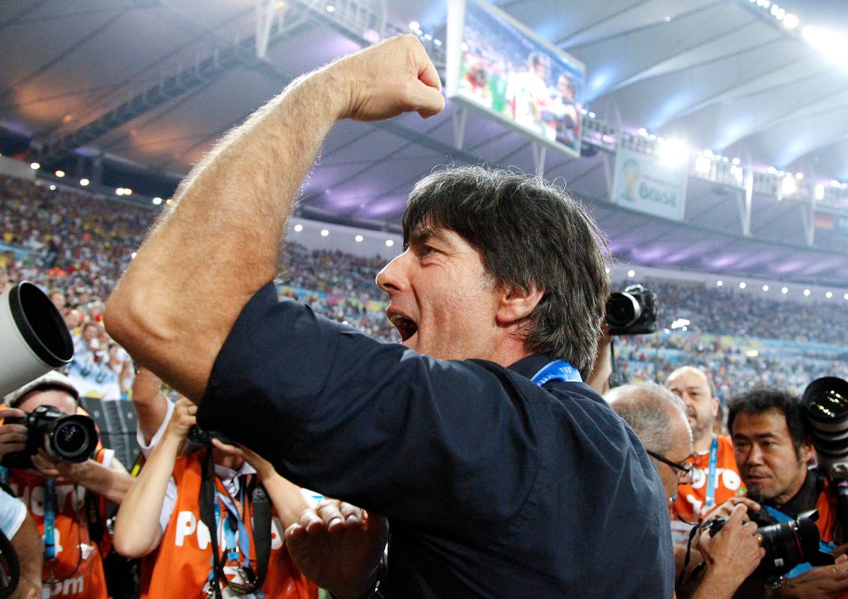 Germany's head coach Joachim Loew acknowledges the cheers during a victory lap after the World Cup final soccer match between Germany and Argentina at the Maracana Stadium in Rio de Janeiro, Brazil, Sunday, July 13, 2014. Germany won the match 1-0. (AP Photo/Matthias Schrader)  (Matthias Schrader)