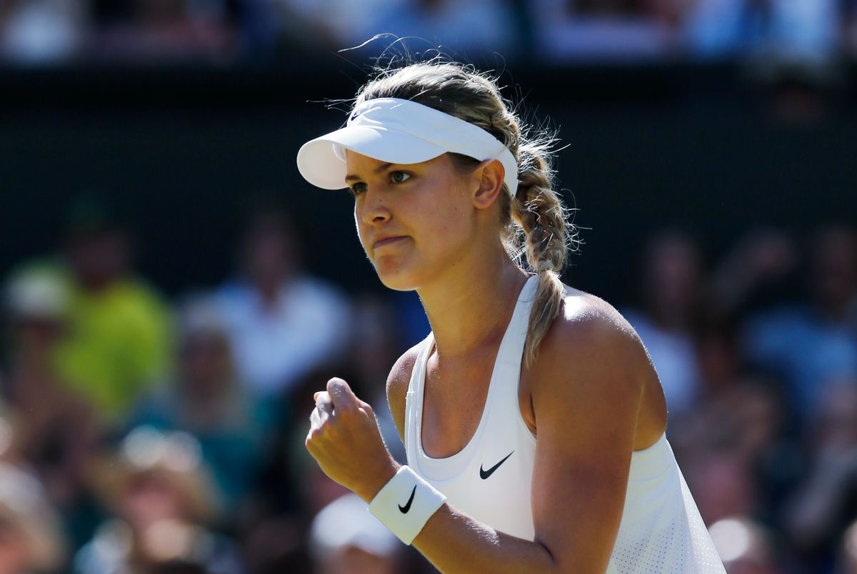 Eugenie Bouchard of Canada celebrates after winning the first set as she plays against Simona Halep of Romania during their womenâs singles semifinal match at the All England Lawn Tennis Championships in Wimbledon, London, Thursday, July 3, 2014. (AP Photo/Ben Curtis) (Ben Curtis)