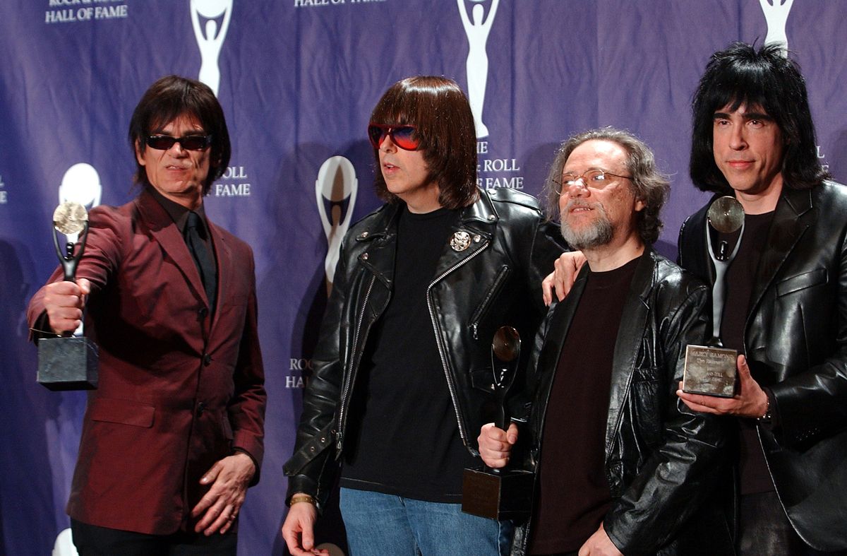 CORRECTS AGE TO 65 AND REMOVES REFERENCE TO WIFE - FILE - In this March 18, 2002, file photo, members of the Ramones, from left to right, Dee Dee, Johnny, Tommy and Marky Ramone hold their awards after being inducted at the Rock and Roll Hall of Fame induction ceremony at New York's Waldorf Astoria. A business associate says Tommy, the last surviving member of the original group, has died. Dave Frey, who works for Ramones Productions and Silent Partner Management, confirmed that he died on Friday, July 11, 2014. Ramone was 65. (AP Photo/Ed Betz, File) (AP)