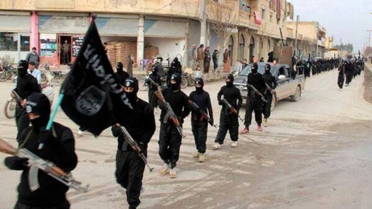 Fighters from the al-Qaida linked Islamic State of Iraq and the Levant (ISIL) marching in Raqqa, Syria   (AP Photo/Militant Website)