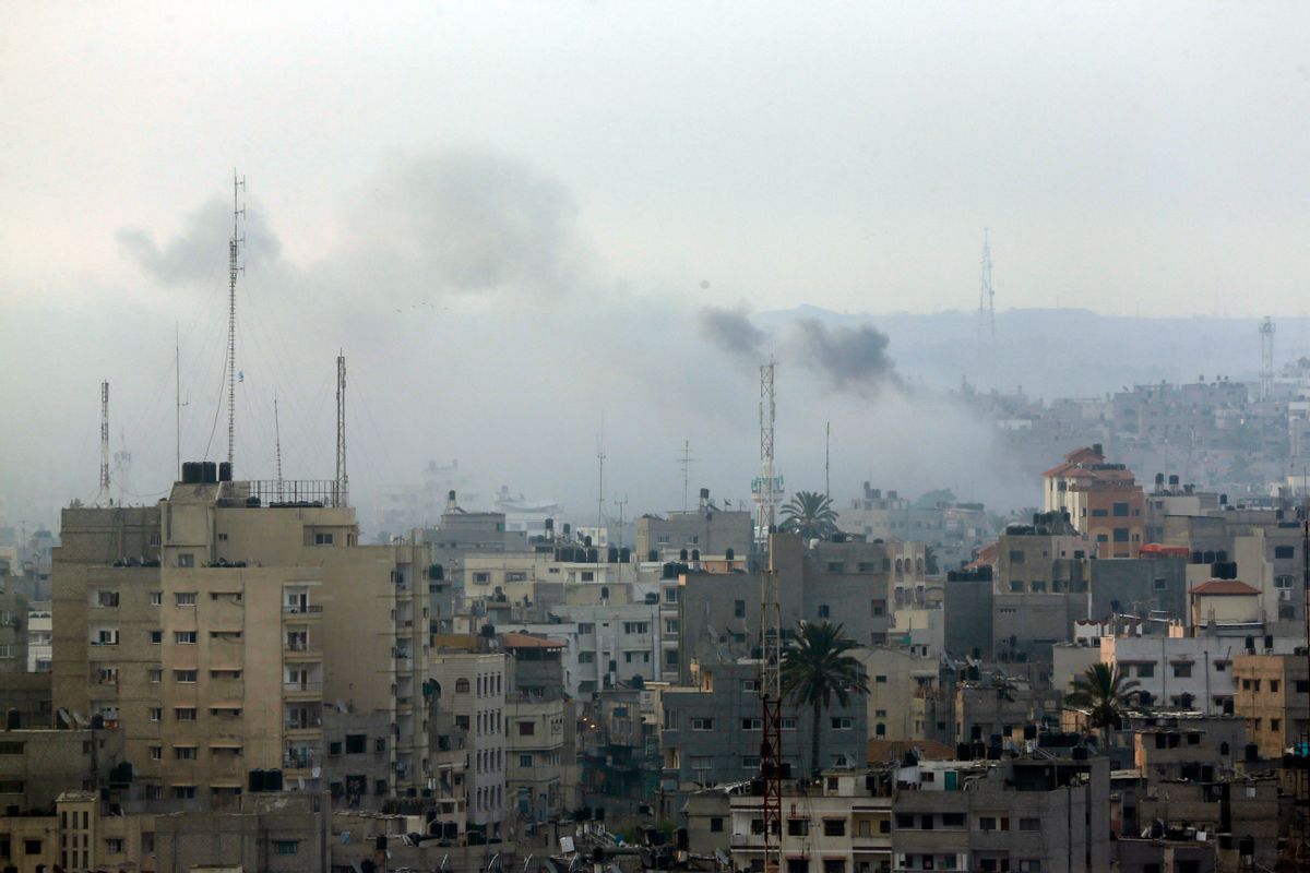 Smoke from Israeli strikes rises over Gaza City , northern Gaza Strip, Sunday, July 20, 2014. Israel said it widened its ground offensive early Sunday, sending more troops into Gaza after demolishing more than a dozen Hamas tunnels and intensifying tank fire on border areas. Since the start of Israel-Hamas fighting almost two weeks ago, over 300 Palestinians were killed and 2,700 wounded in Israeli air and artillery strikes, according to Palestinian health officials. One-fourth of the deaths were reported since the start of the ground offensive late Thursday, the officials said.(AP Photo/Lefteris Pitarakis)  (AP)