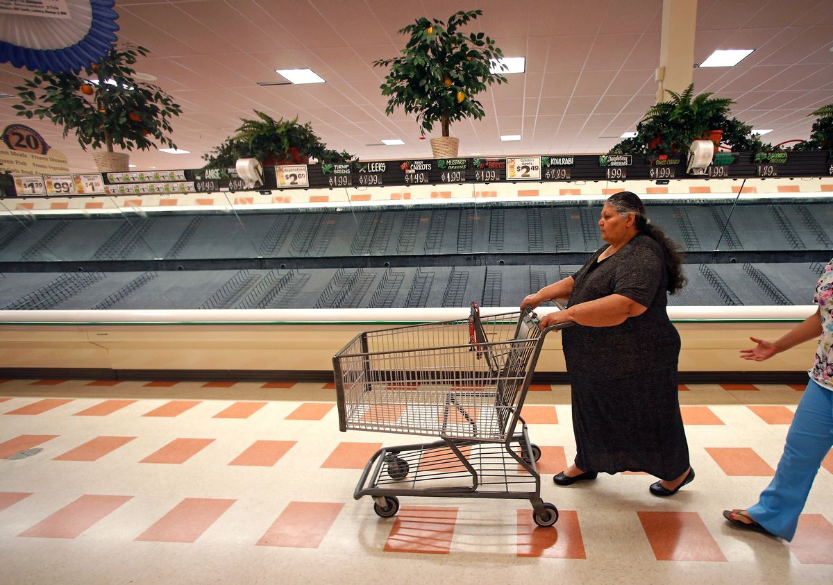 Maria Arvarado, of Haverhill, Mass. finds empty produce bins as she shops Thursday, July 24, 2014 at Market Basket supermarket in Haverhill, Mass. A decades-long family feud, which brought about the ouster of Arthur T. Demoulas as CEO of the privately held company, led to a worker revolt, customer boycotts and empty shelves in the grocery chain's stores in Maine, Massachusetts and New Hampshire. More than 100 Massachusetts legislators and mayors, Massachusetts Attorney General Martha Coakley, and New Hampshire Gov. Maggie Hassan have publicly supported the employees. (AP Photo) (AP)