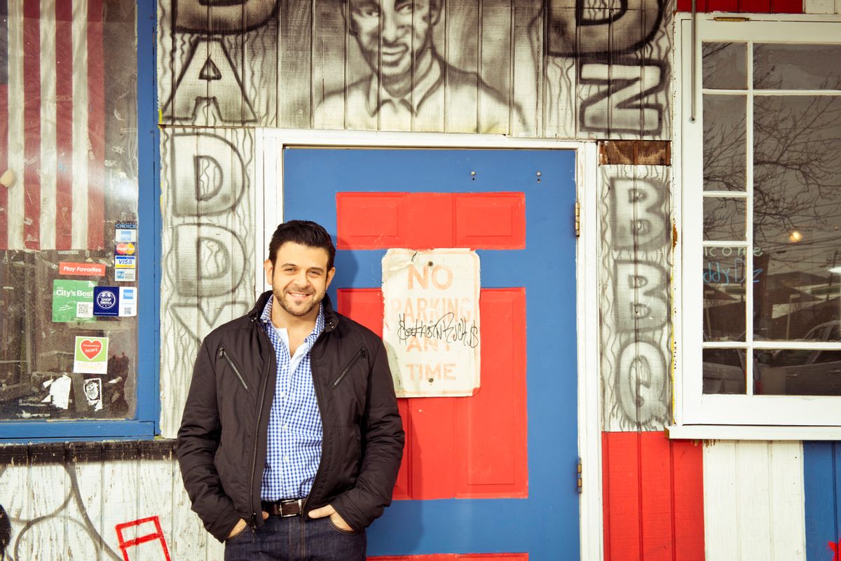This undated photo provided by the Travel Channel shows host Adam Richman of the new series, "Man Finds Food" in Atlanta.  The channel said Tuesday, July 1, 2014, that Richman's show has been postponed indefinitely but didn't explain why. "Man Finds Food" was to debut Wednesday. (AP Photo/Travel Channel, Gabriela Herman)  (AP)