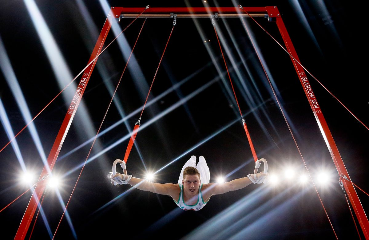 10ThingstoSeeSports - Lights flare as Harry Owen of Wales performs on the rings during the Men's All-Around gymnastics competition at the Scottish Exhibition Conference Centre during the Commonwealth Games 2014 in Glasgow, Scotland, Wednesday, July 30, 2014. (AP Photo/Kirsty Wigglesworth, File) (AP)