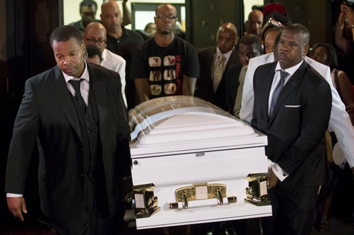 Pallbearers carry the casket of Eric Garner at Bethel Baptist Church following his funeral service, July 23, 2014, in Brooklyn, N.Y.                  (AP/John Minchillo)