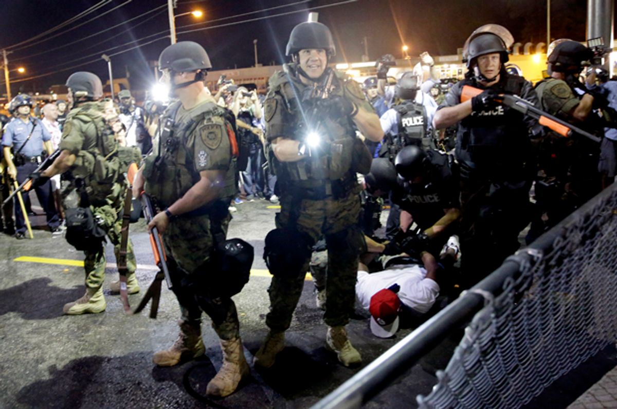 A man is arrested as police try to disperse a crowd during protests in Ferguson, Mo., Aug. 20, 2014.             (AP/Jeff Roberson)