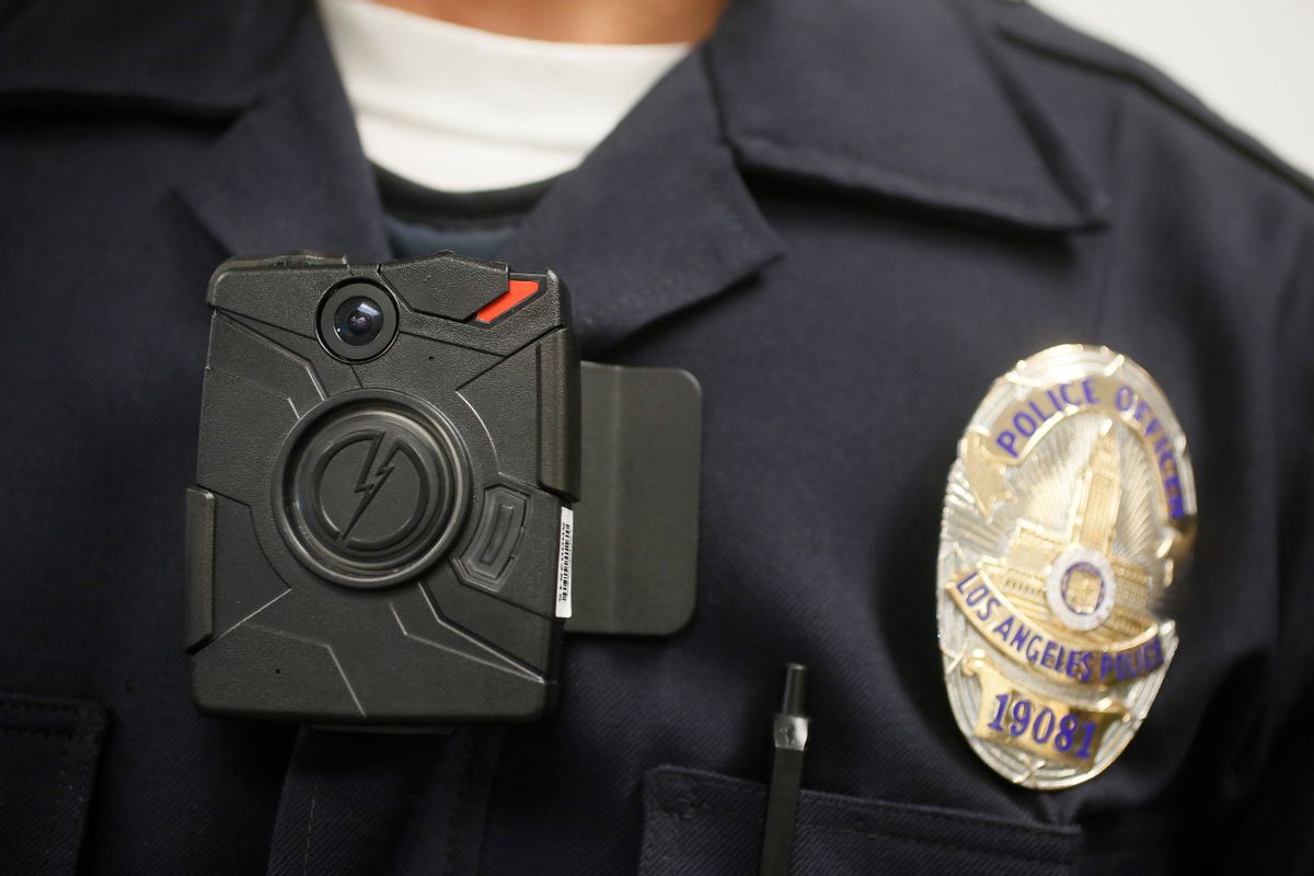 FILE - In this Jan. 15, 2014 file photo, a Los Angeles Police officer wears an on-body camera during a demonstration for media in Los Angeles. The fatal police shooting of the unarmed black teenager in Ferguson, Mo. has prompted calls for more officers to wear so-called "body cameras," simple, lapel-mounted gadgets that record the interactions between the public and law enforcement. (AP/Damian Dovarganes)