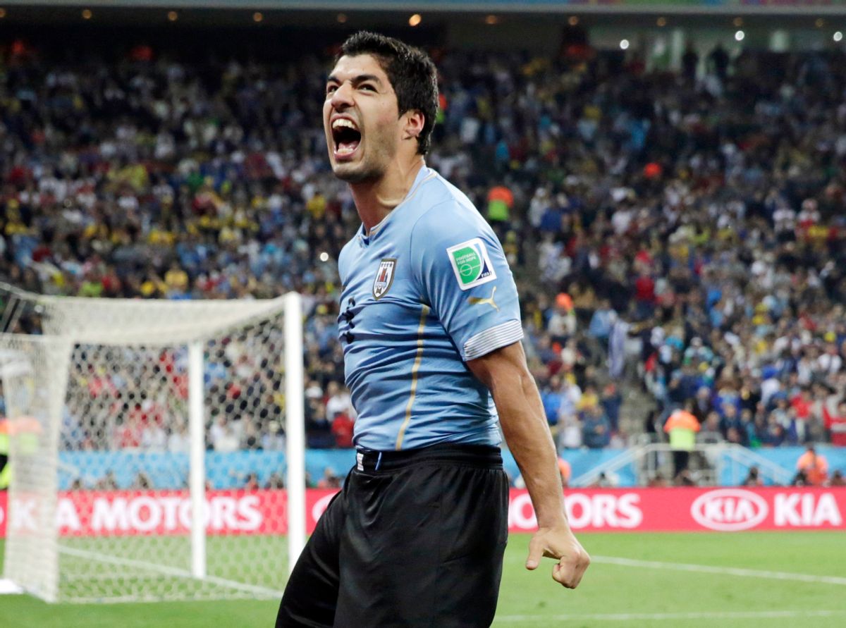 FILE - This is a Thursday, June 19, 2014 file photo of  Uruguay's Luis Suarez as he celebrates after scoring his side's second goal during the group D World Cup soccer match between Uruguay and England at the Itaquerao Stadium in Sao Paulo, Brazil.  The Court of Arbitration for Sport on Thursday Aug. 14, 2014 upheld Luis Suarez's four-month ban for biting an opponent at the World Cup, but cleared him to train with Barcelona.   (AP Photo/Matt Dunham, File) (AP)