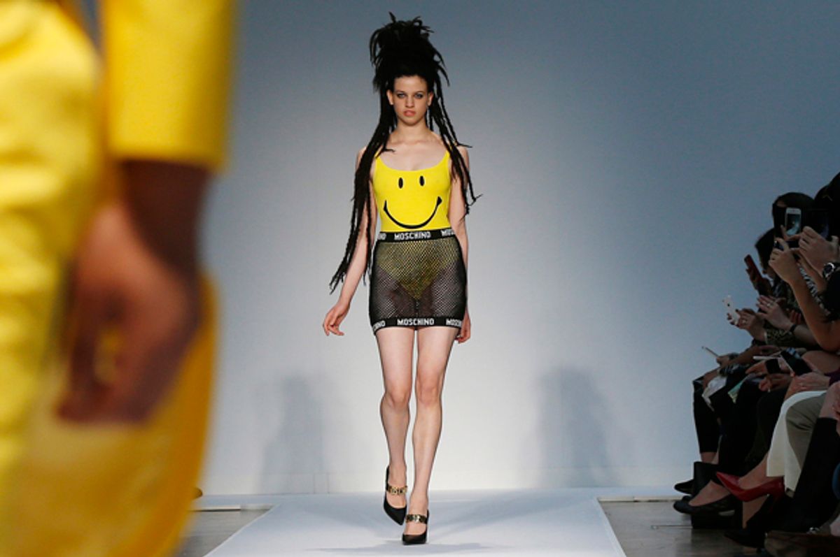 Models present creations from Moschino in London, June 16, 2014.       (Reuters/Suzanne Plunkett)