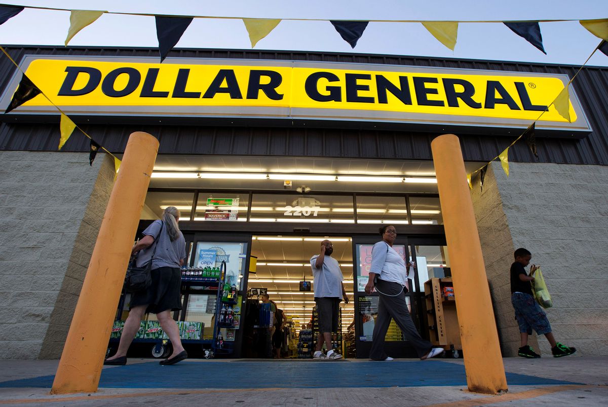 FILE - In this Wednesday, Sept. 25, 2013, file photo, customers exit a Dollar General store, in San Antonio. Dollar General is going hostile with its $9.1 billion bid for Family Dollar after repeated rejections of previous offers by its rival. The discount chain said Wednesday Sept. 10, 2014 that it is offering investors of Family Dollar Inc. $80 per share in cash, the same offer that was rejected last week by the company board. (AP Photo/Eric Gay, File) (AP)