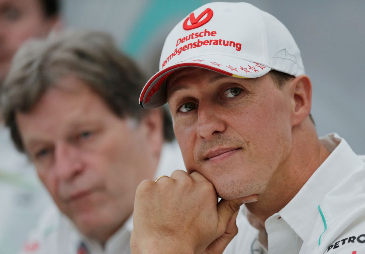 FILE - In this Thursday, Oct. 4, 2012 file photo, former Mercedes F1 driver Michael Schumacher of Germany pauses during a news conference to announce his retirement from Formula One at the end of  2012  in Suzuka, Japan.  Former Formula One world champion Michael Schumacher has left hospital to continue his recovery at home, his manager said Tuesday. The seven-time champion suffered a serious head injury while skiing in France in December, resulting in him being put in a coma. (AP Photo/Shizuo Kambayashi, File) (AP)