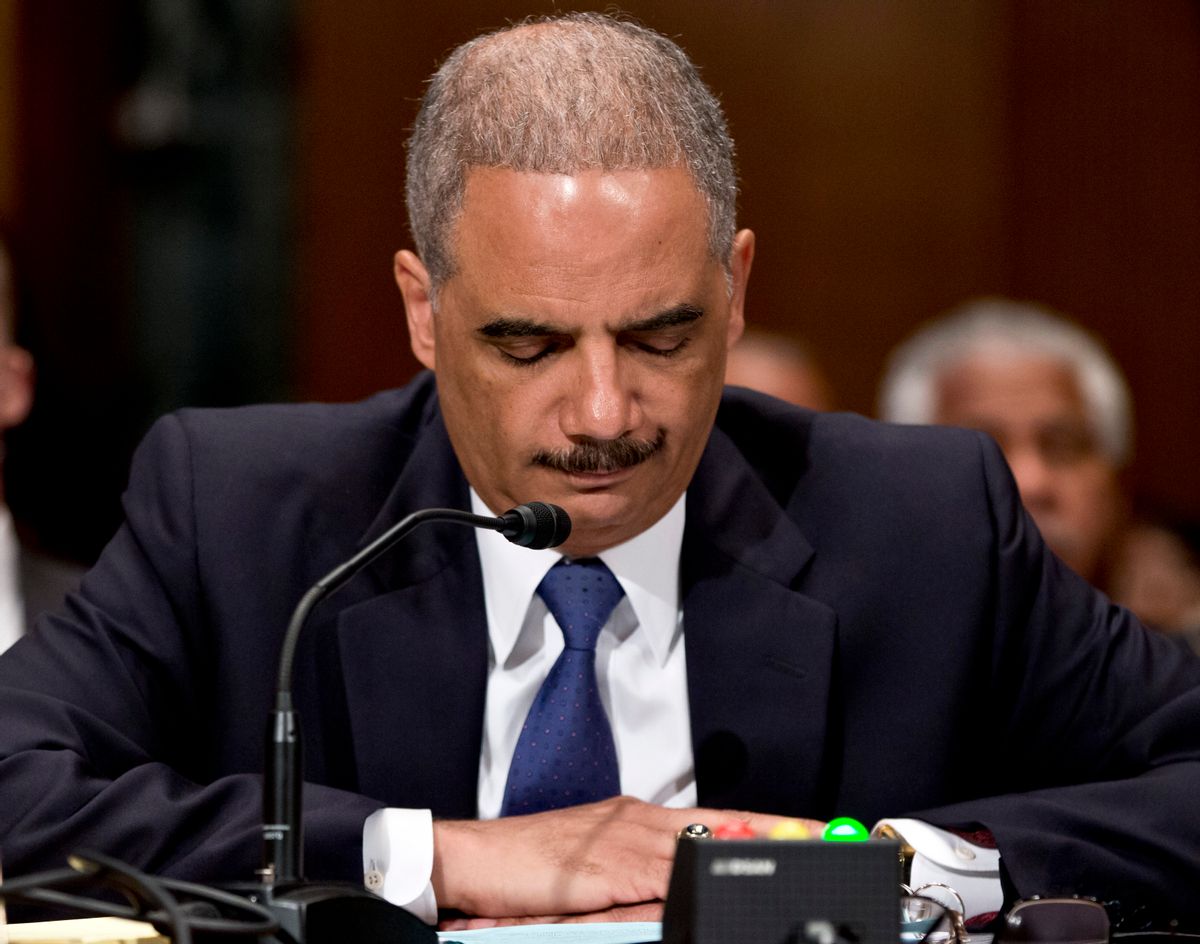 FILE - This June 6, 2013, file photo shows U.S. Attorney General Eric Holder testifying on Capitol Hill in Washington before a Senate Appropriations subcommittee, where Holder denied that the Obama administration is killing suspected terrorists with drone strikes to avoid capturing them and sending them to the Guantanamo prison it wants to close. Holder, who announced Thursday, Sept. 25, 2014, that he would step down once a successor is confirmed, took office determined to turn the page from Bush administration policies that authorized harsh interrogation techniques against suspected terrorists.  (AP Photo/J. Scott Applewhite, File) (AP)
