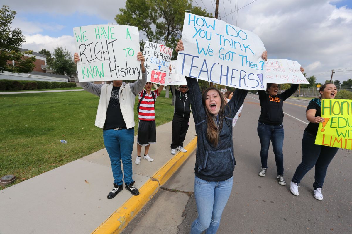 Students protest against a Jefferson County School Board proposal to emphasize patriotism and downplay civil unrest in the teaching of U.S. history, in front of their school, Jefferson High, in the Denver suburb of Edgewater, Monday, Sept. 29, 2014. The Jefferson County School District says classes had to be canceled at Golden and Jefferson high schools on Monday because so many teachers called in sick. (AP/Brennan Linsley)