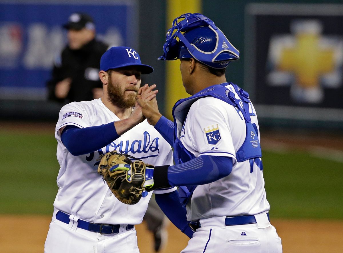 Kansas City Royals relief pitcher Greg Holland is congratulated by Salvador Perez following Game 3 of the American League baseball championship series Tuesday, Oct. 14, 2014, in Kansas City, Mo. The Royals won 2-1 and lead the series 3-0. (AP Photo/Matt Slocum ) (Matt Slocum)