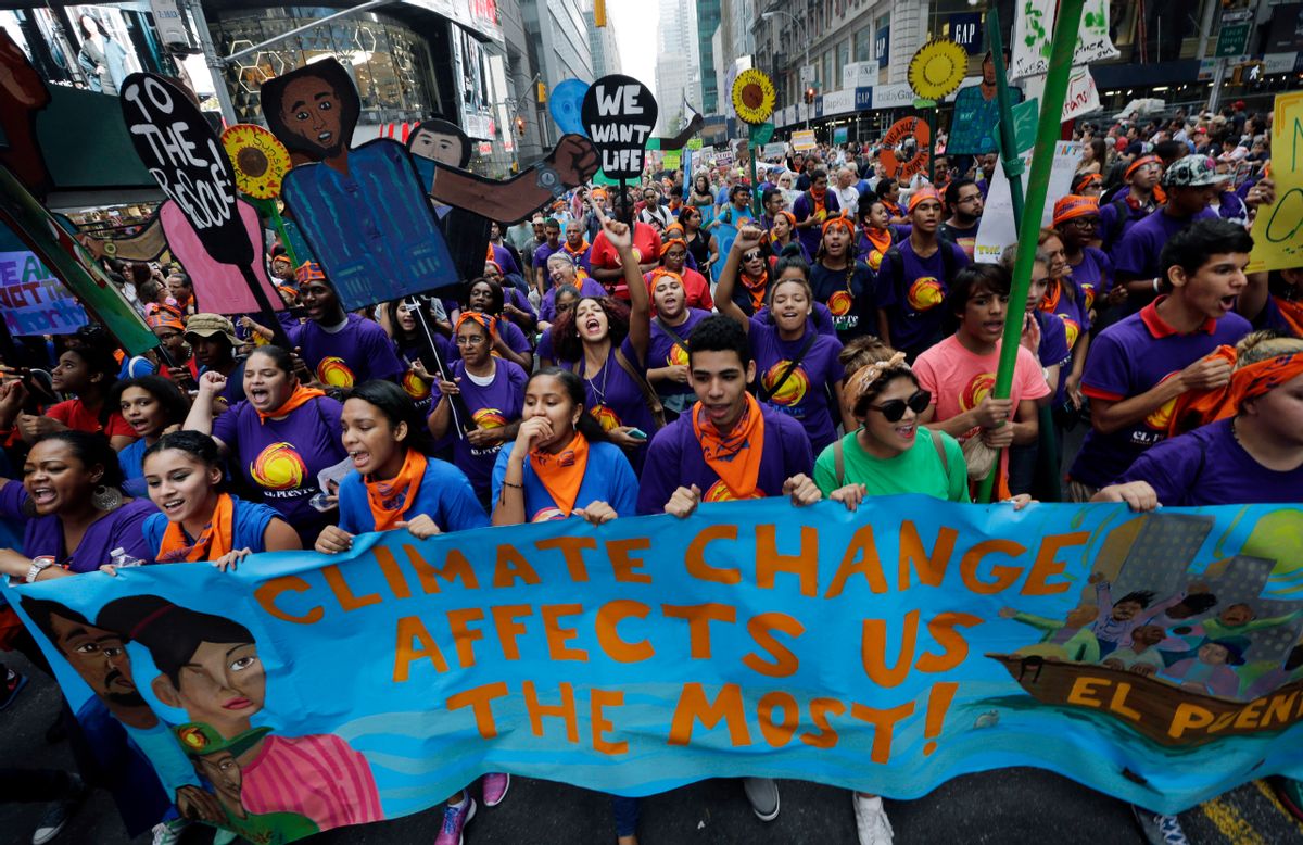 FILE - In the Sept. 21, 2014 file photo thousands of young people fill the streets of Manhattan, New York, carrying banners and calling on policymakers to take action on climate change. According to a new Associated Press-GfK poll, conducted September 25-29, 2014, Americans lack confidence that their government can keep them safe from threats to their safety and economic security. More than half of those polled dont think the U.S. government can do much to effectively minimize the threat posed by climate change, mass shootings, racial tensions, economic uncertainty on Wall Street and an unstable job market. (AP Photo/Mel Evans, File) (AP)