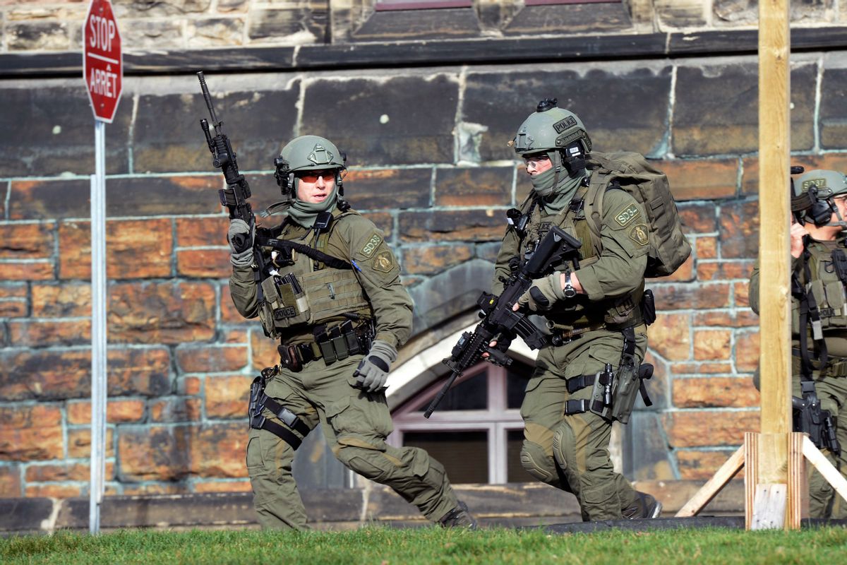 A Royal Canadian Mounted Police intervention team responds to a reported shooting at Parliament building in Ottawa, Wednesday, Oct. 22, 2014. (AP Photo/The Canadian Press, Adrian Wyld)   (AP)