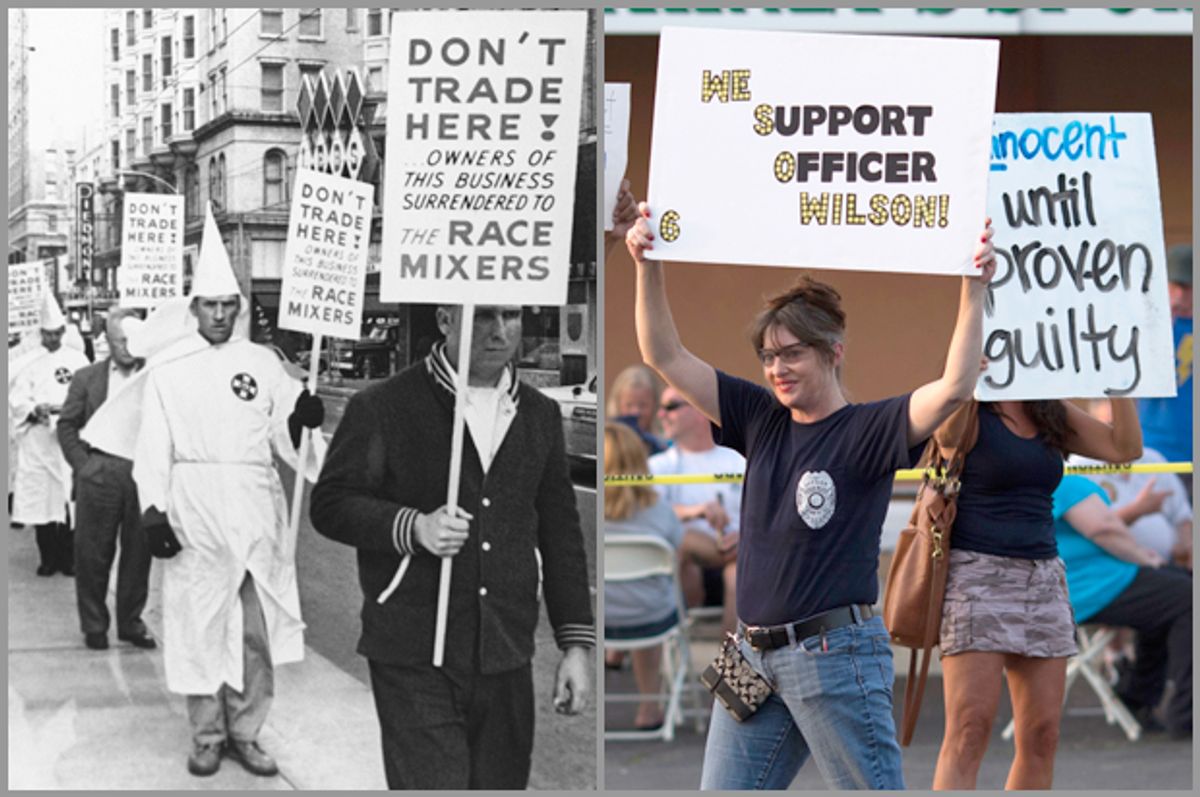 Unidentified Ku Klux Klan members are among those picketing a restaurant, July 11, 1964, Atlanta, Ga.; supporters of Darren Wilson hold placards in St. Louis, Mo., Aug. 23, 2014.                   (AP/Reuters/Adrees Latif)