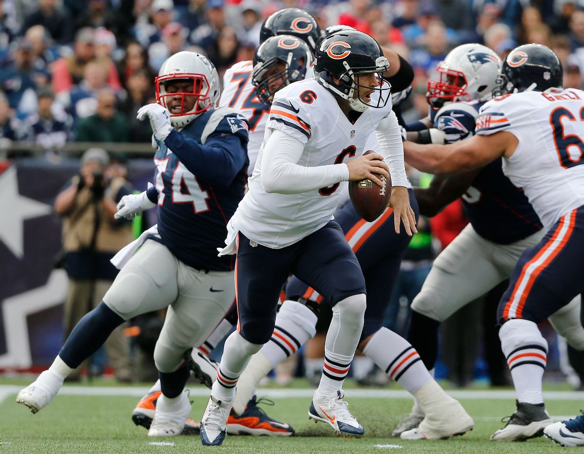 Chicago Bears quarterback Jay Cutler (6) scrambles from a rush by New England Patriots defensive tackle Dominique Easley (74) in the first half of an NFL football game on Sunday, Oct. 26, 2014, in Foxborough, Mass. (AP Photo/Elise Amendola) (AP)