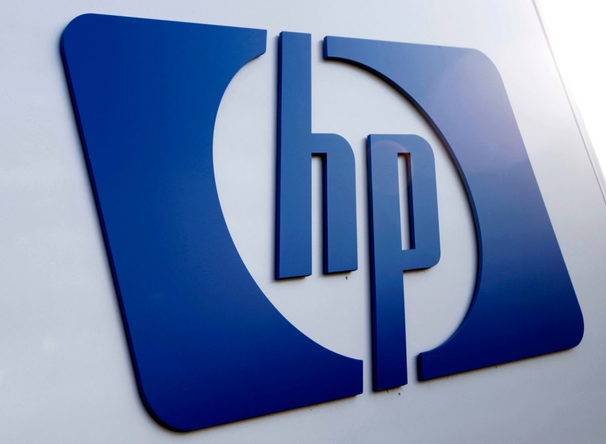 FILE - This Feb 21, 2012 file photo shows a Hewlett Packard logo in Frisco, Texas. Hewlett-Packard on Monday, Oct. 6, 2014 said it is splitting itself into two companies, one focused on its personal computer and printing business and another on technology services, such as data storage, servers and software, as it aims to drive profits higher. (AP Photo/LM Otero, File) (AP)