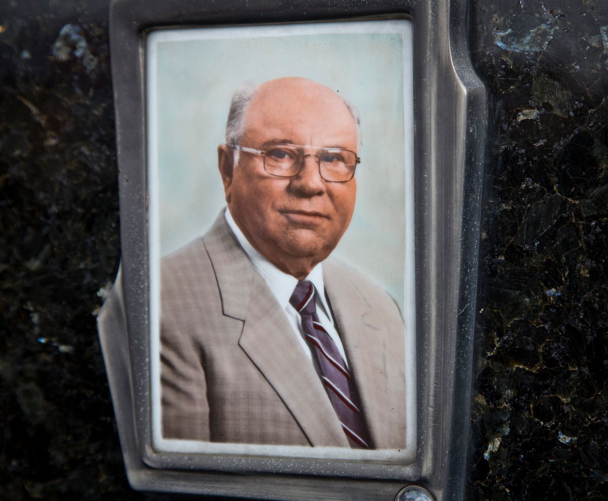 This July 28, 2014, photo shows Jakob Denzinger's portrait on the tombstone of his empty grave in Cepin eastern Croatia. Denzinger is among dozens of death camp guards and suspected Nazi war criminals who collected millions of dollars in Social Security payments despite being forced out of the United States according to an Associated Press investigation. (AP Photo/Darko Bandic) (AP)