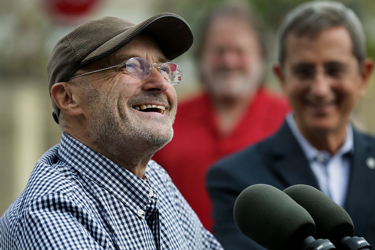 Phil Collins smiles as he speaks to the media with Texas Land Commissioner Jerry Patterson, right, during a news conference on Tuesday, Oct. 28, 2014 in San Antonio. Collins has handed over his vast collection of artifacts related to the Battle of the Alamo and the Texas Revolution to the state of Texas.  Collins donated what's considered the world's largest private collection of Alamo artifacts. It includes a fringed leather pouch and a gun used by Davy Crockett and Jim Bowie's legendary knife.  (AP Photo/The San Antonio Express-News, Bob Owen)  RUMBO DE SAN ANTONIO OUT; NO SALES (AP)