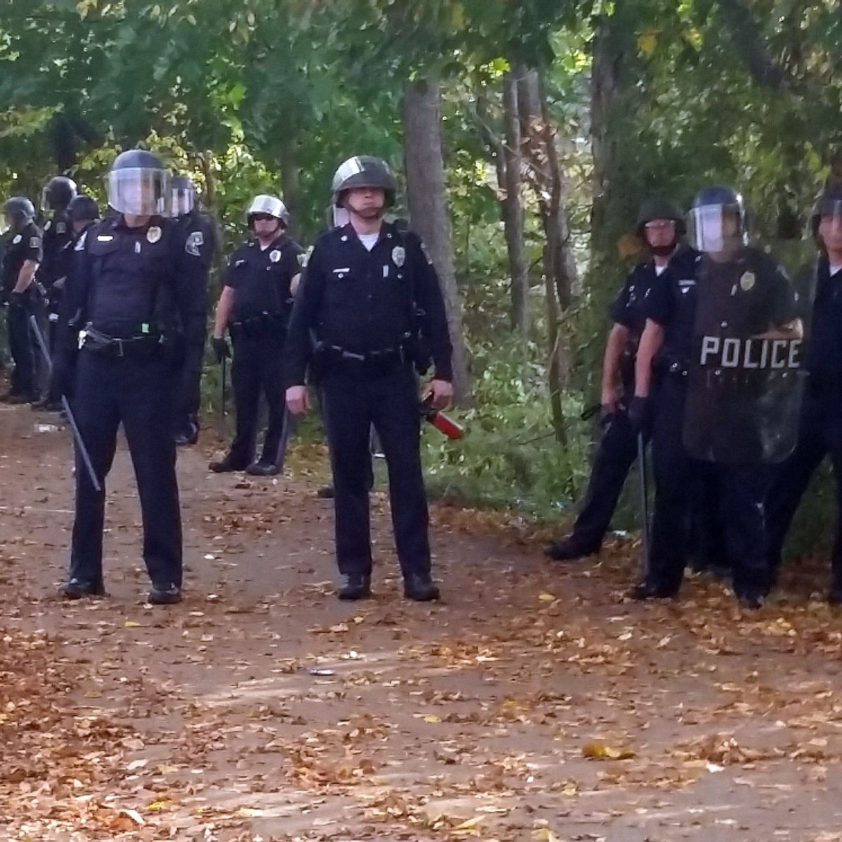 In this photo provided by Seth Meyer police officers line up. Local police, firefighters and ambulances in New Hampshire responded to large crowds of students as the annual Pumpkin Festival is underway near Keene State College Saturday, Oct. 18, 2014.  (AP/Seth Meyer)