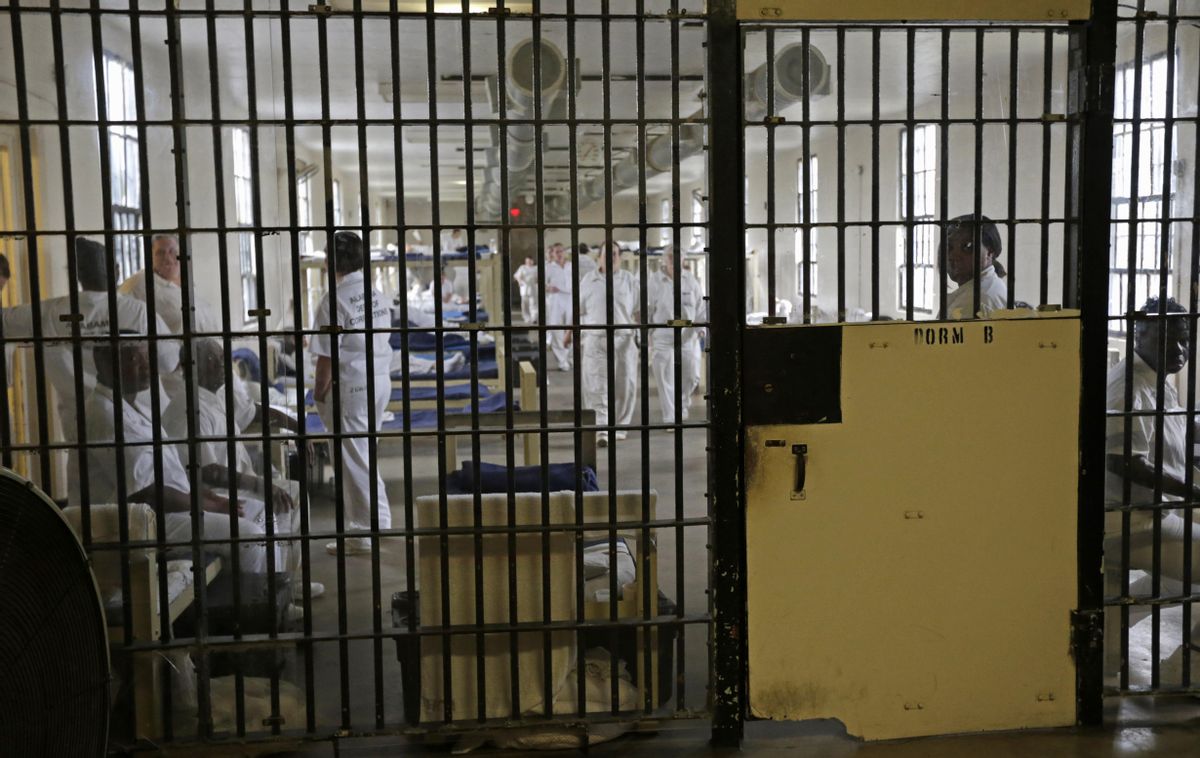 FILE - In this Sept. 23, 2013 file photo, inmates sit in their bunks in Dorm B at Tutwiler Prison for Women in Wetumpka, Ala. (AP Photo/Dave Martin, File) (AP)
