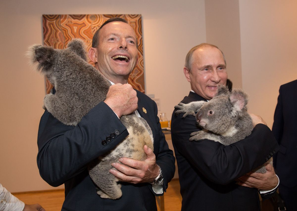 In this photo released by G20 Australia and taken on Saturday Nov 15, 2014, Prime Minister of Australia Tony Abbott and President of Russia Vladimir Putin hold koala's during a photo opportunity on the sidelines of the G-20 summit in Brisbane, Australia.  (AP Photo/G20 Australia,Andrew Taylor) (AP)