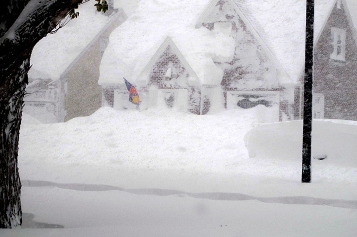 A house is obscured by wind-blown, lake-effect snow, Nov. 18, 2014 in Buffalo, N.Y.       (AP/Carolyn Thompson)