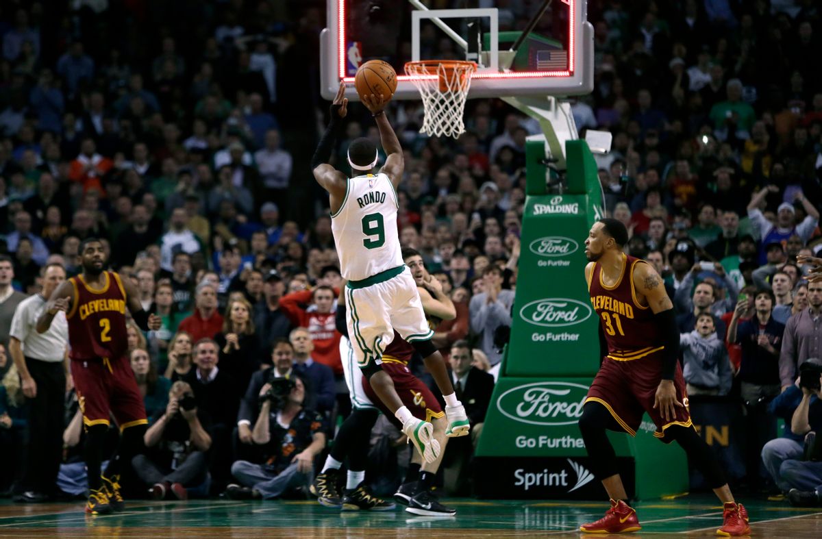 Boston Celtics guard Rajon Rondo (9) puts up a shot at the final buzzer, which he missed, during the second half of an NBA basketball game in Boston, Friday, Nov. 14, 2014. The Cavaliers edged out the Celtics 122-121. (AP Photo/Charles Krupa) (AP)