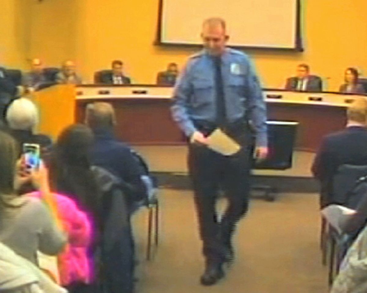 FILE - In this file Feb. 11, 2014 image from video released by the City of Ferguson, Mo., is officer Darren Wilson at a city council meeting in Ferguson. A  grand jury said Monday, Nov. 24, 2014 that it has reached a decision about whether to indict Wilsoin in the shooting death of Michael Brown, according to a lawyer for Brown's family. (AP Photo/City of Ferguson) (AP)