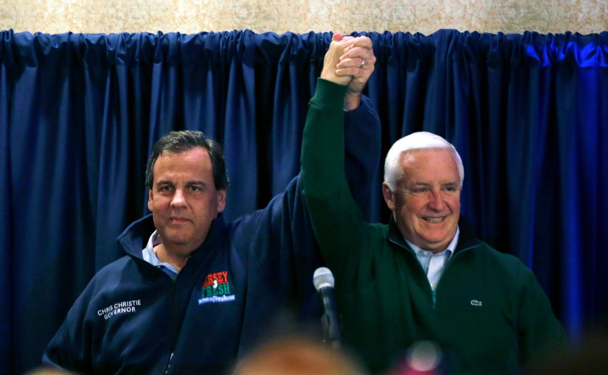 Pennsylvania Gov. Tom Corbett, right, and New Jersey Gov. Chris Christie raises the arms at a gathering at a campaign rally Sunday, Nov. 2, 2014, in Ivyland, Pa. Corbett will face Democratic challenger Tom Wolf in Tuesday's election. (AP Photo/Mel Evans) (AP)