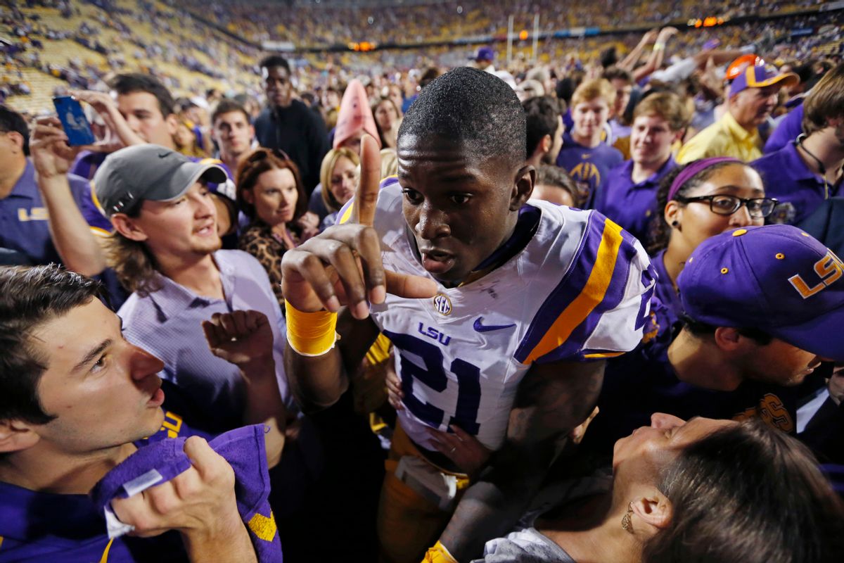 FILE - In this Oct. 25, 2014, file photo, LSU defensive back Rashard Robinson (21) celebrates after the team's NCAA college football game against Mississippi in Baton Rouge, La. Alabama and LSU meet in Baton Rouge, La., on Saturday, Nov. 8. Alabama is ranked second among all Football Bowl Subdivision teams and LSU is fourth in scoring defense. (AP Photo/Jonathan Bachman, File) (AP)