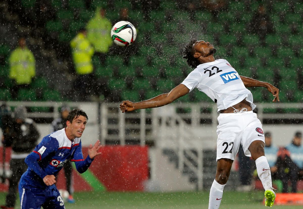 10ThingstoSeeSports - Western Sydney Wanderers' Seyi Adeleke, right, jumps to head the ball as Cruz Azul's Mauro Formica looks on during their soccer match at the Club World Cup soccer tournament in Rabat, Morocco, Saturday, Dec. 13, 2014. (AP Photo/Christophe Ena, File) (AP)