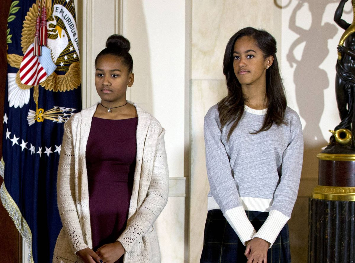 Malia and Sasha Obama at the 2014 presidential turkey pardon ceremony.                     (Associated Press)