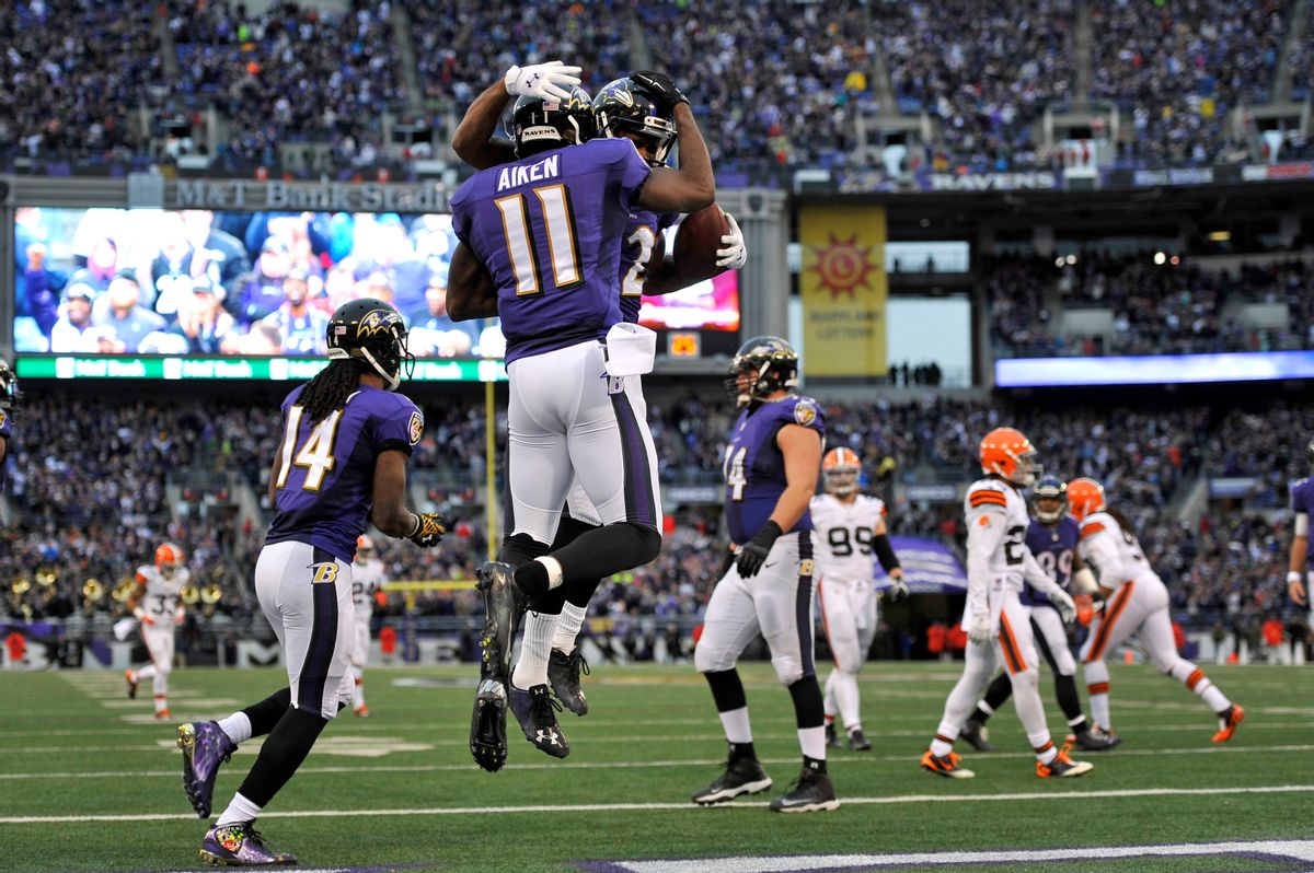 Baltimore Ravens wide receiver Kamar Aiken (11) celebrates his touchdown with teammate Torrey Smith in the second half of an NFL football game against the Cleveland Browns, Sunday, Dec. 28, 2014, in Baltimore. Baltimore won 20-10. (AP Photo/Gail Burton) (AP)
