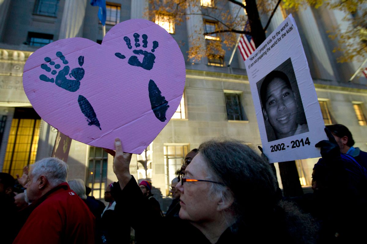 Demonstrators protest against the shooting death of unarmed 18-year-old Michael Brown at the Department of Justice in Washington, Monday, Dec. 1, 2014. A grand jury in Ferguson, Mo., on Monday, Nov. 24, 2014, declined to indict police officer Darren Wilson in the shooting death of Brown, an unarmed black man. Protesters across the U.S. have walked off their jobs or away from classes in support of the Ferguson protesters. Monday's walkouts stretched from New York to San Francisco, and included Chicago and Washington, D.C.  (AP Photo/Jose Luis Magana) (AP)
