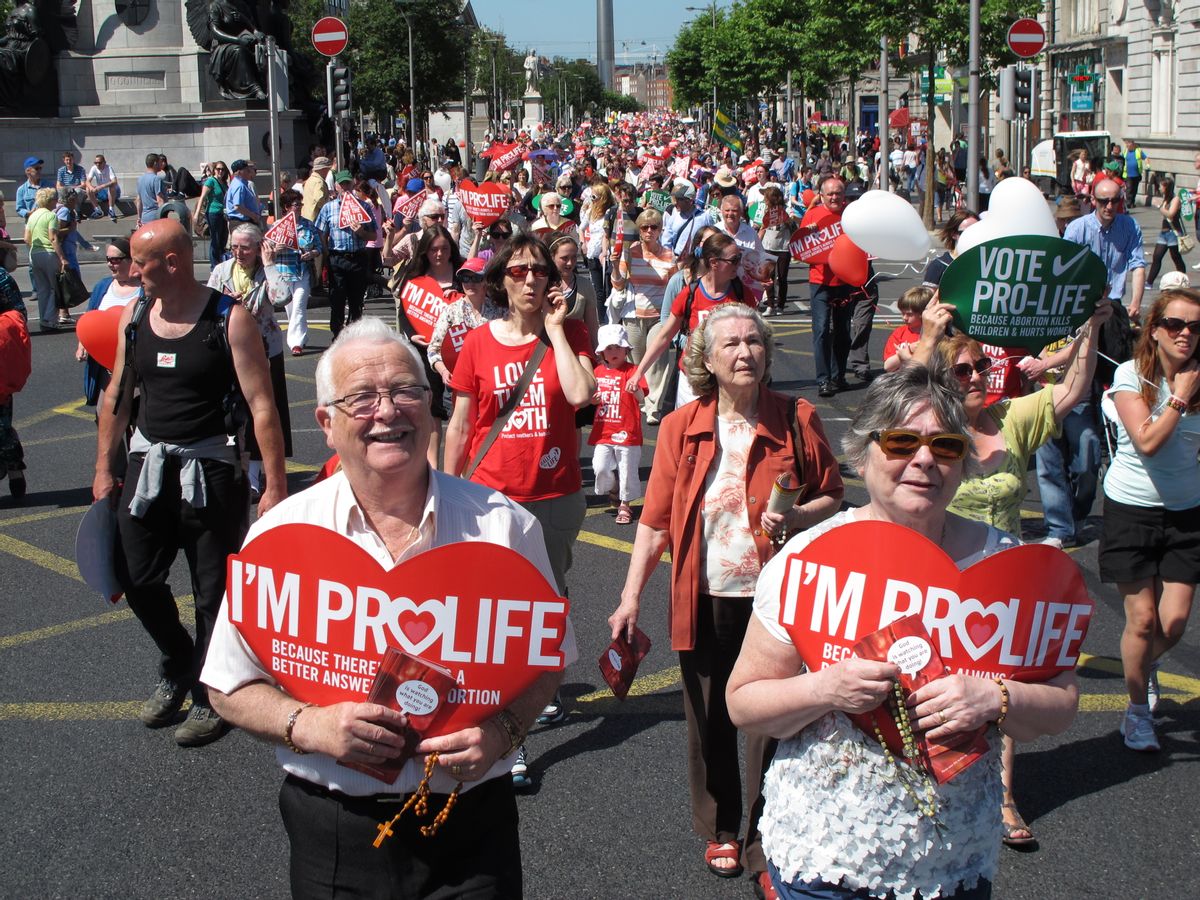 FILE - A Saturday, July 6, 2013 file photo showing Stephen and Pauline O'Brien, foreground, holding Catholic rosary beads as they march through Ireland's capital, Dublin, in an anti-abortion protest. (AP Photo/Shawn Pogatchnik, File) (AP)