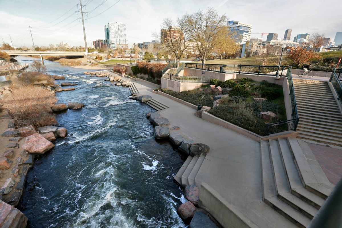 In this Monday, Dec. 8, 2014 photo, water flows past a sculpted landscape at Confluence Park, where Cherry Creek joins the South Platte, a key channel in Colorados water supply, in Denver. (AP Photo/Brennan Linsley) (AP)