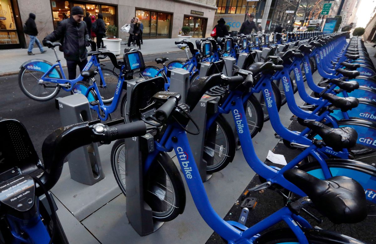 Citbike cyclists pick up their rides near Grand Central Terminal, in New York, Tuesday, Jan. 13, 2015. Now that it has moved from laid-back Portland, Oregon, to amped-up New York, the company that runs bike-sharing programs in New York, Chicago and other major cities is changing its name from Alta Bicycle Share to Motivate. (AP Photo/Richard Drew) (AP)