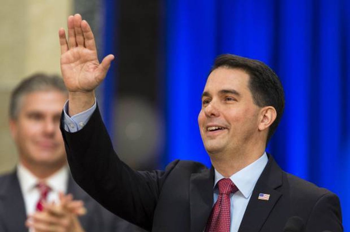 Wisconsin Gov. Scott Walker acknowledges the crowd after being inaugurated for his second term.     (AP/Andy Manis)