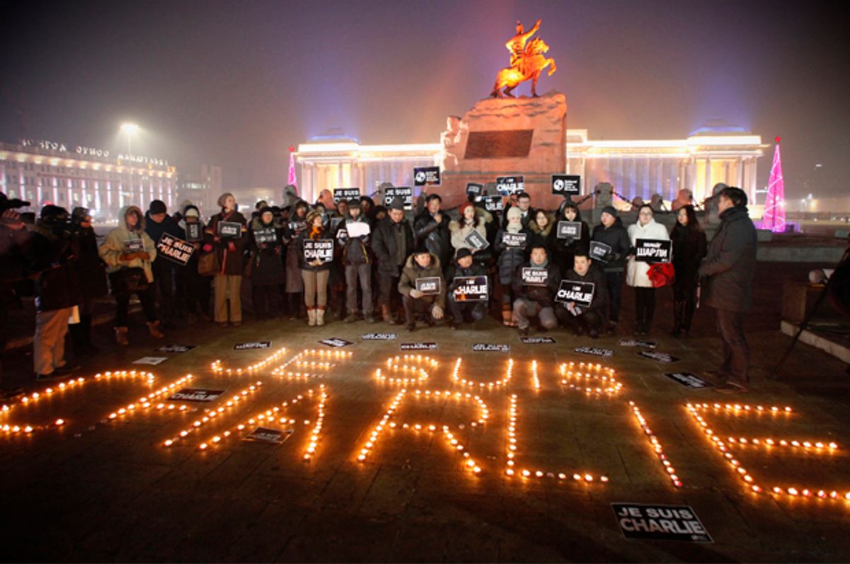 Mongolian journalists at a candlelight vigil at Genghis Square, in Ulan Bator January 9, 2015.      (Reuters/Rentsendorj Bazarsukh)