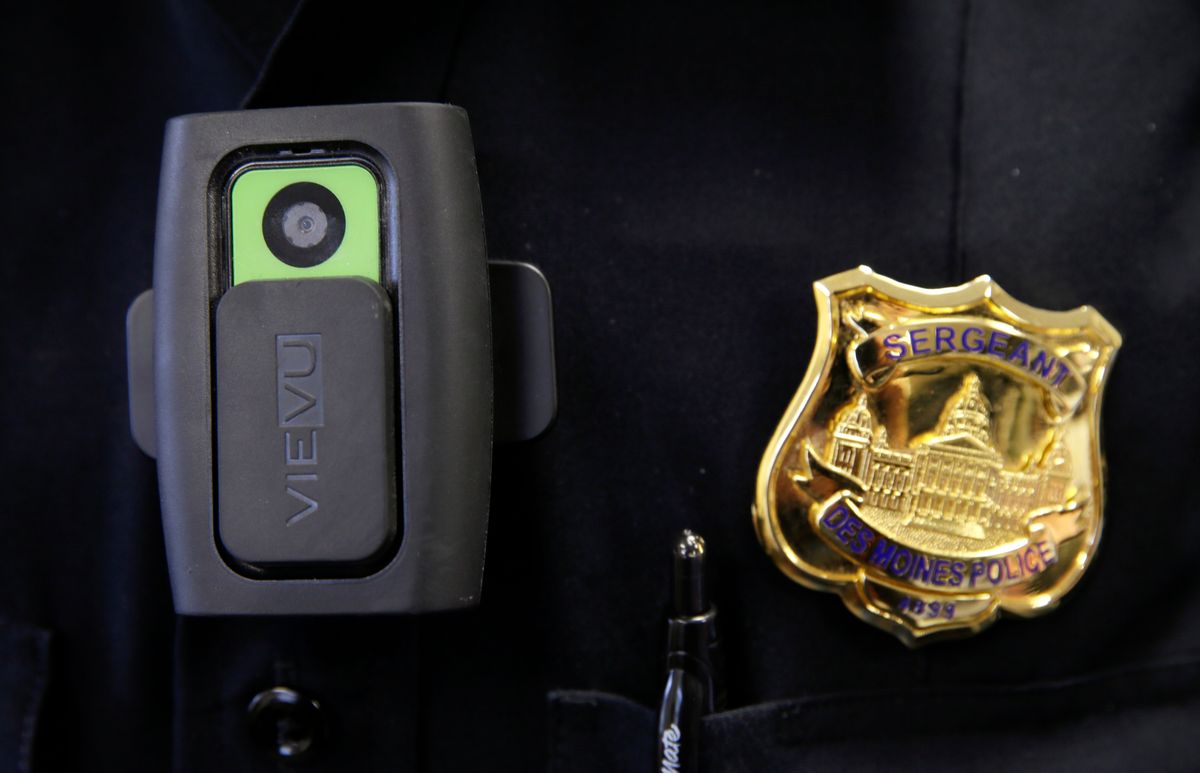 In this Jan. 22, 2015 photo, a body camera used by Des Moines Police Department school resource officers is worn by Sgt. Jason Halifax in Des Moines, Iowa. The rush by cities to outfit police officers with body cameras after last summers riots in Ferguson, Mo., is saddling local governments with steep costs for managing the volumes of footage they must keep for months or even years, according to contracts, invoices and company data reviewed by The Associated Press. (AP Photo/Charlie Neibergall) (AP)